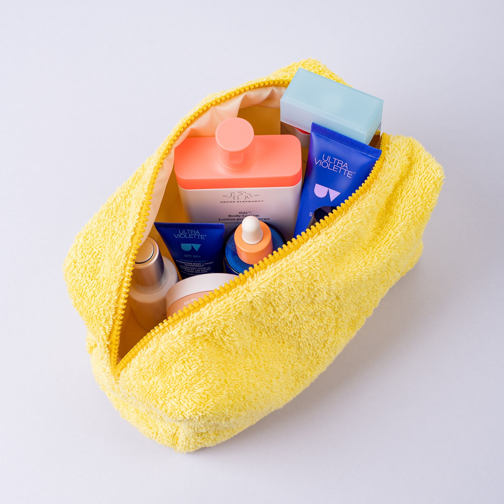 yellow sustainable organic cosmetic bag with products